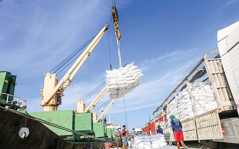 Journeying Beyond Borders Export rice bags being loaded onto the overseas merchant vessel at Yangon Port