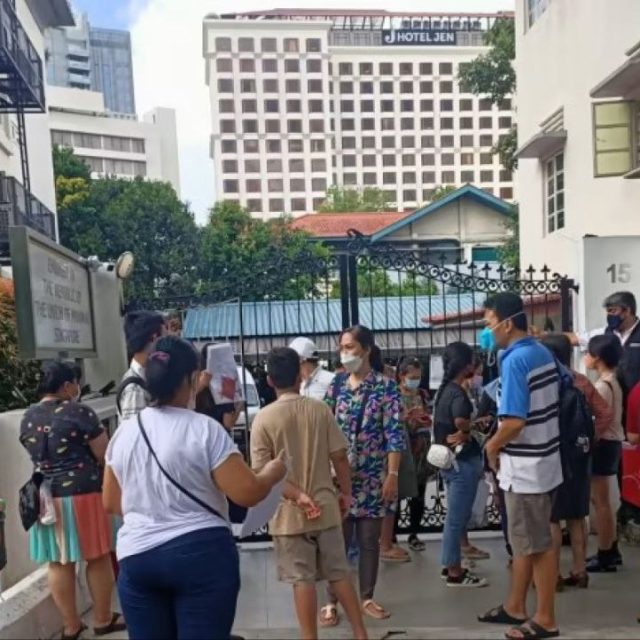 People waiting to renew their passports at the Myanmar Embassy in Singapore in 2023.